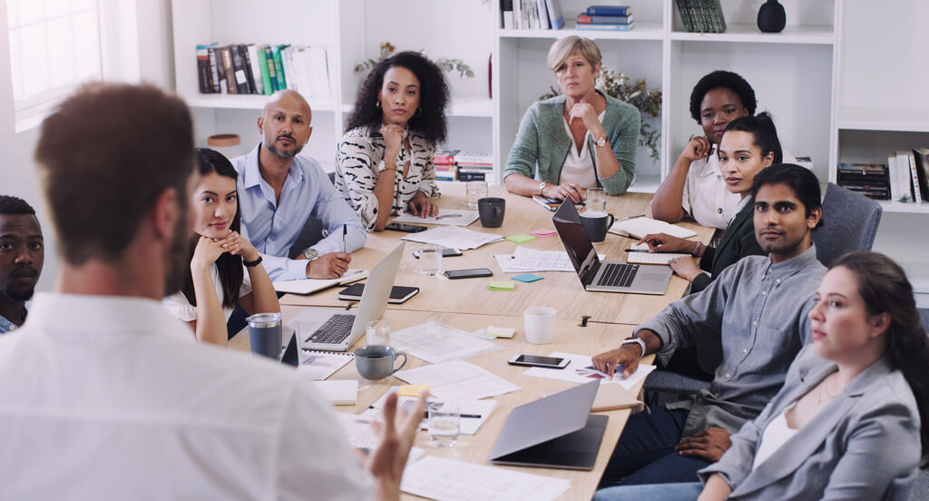 A group of professionals gathered around a table
