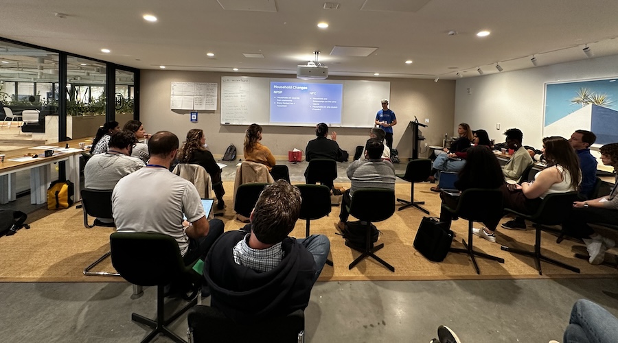 A group of folks gathered around for a presentation at NPSP Day DC