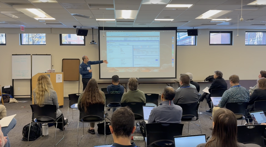 A group of folks gathered around for a presentation at NPSP Day Philadelphia
