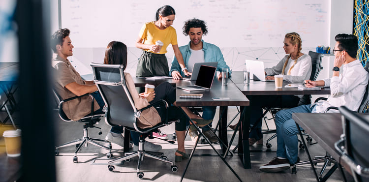 A group of fundraising professionals strategizing about scaling their fundraising efforts.